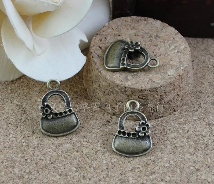 100 pcs Antique Bronze Handbag Shape Charms Pendants for Jewelry Making