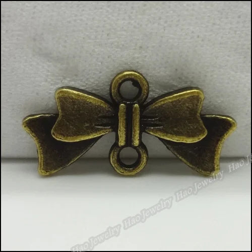 100pcs Vintage Charms Bow Pendant Bronze DIY Jewelry Making