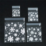 100pcs Merry Christmas Transparent Snowflake Gift Bags Self-adhesive Cookie Bags