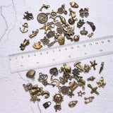 100pcs Bronze Vintage Metal Charms Jewelry Making Set DIY 9-26MM