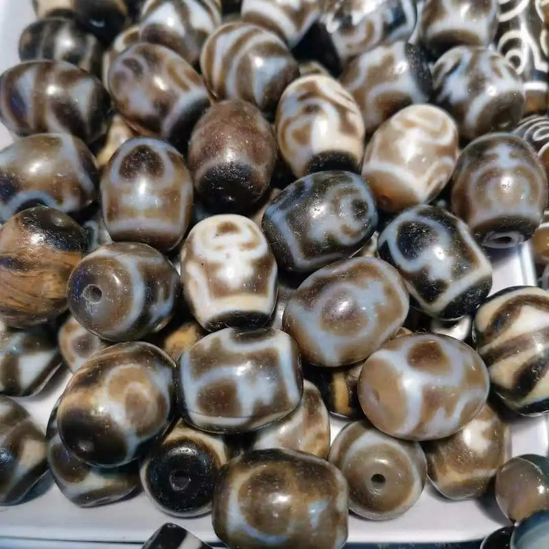 Weathered old agate double tiger tooth dalo dzi beads