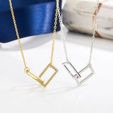 Double Ring Cross Necklace with Diamond Accent