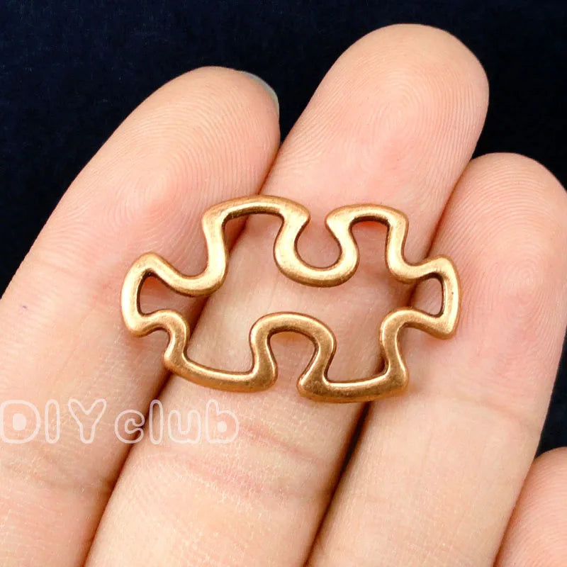 60pcs Puzzle Piece Charms, Copper Tone JigSaw Puzzle Pendants 30x18mm