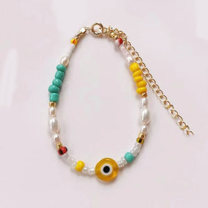 Handmade Bohemian Beads Bracelet with Yellow Eye Embellishment