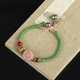 Boho Rose Quartz Wrap Bracelet with Copper Bell Dangle