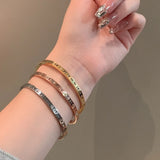 Classic Hollow Roman Numeral Steel Bracelet for Women