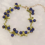 Cloud Jewelry Women's Cranberry Purple Stone Bracelet with Multicolor Flowers