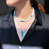 Soft Pottery Round Female Necklace with Pine Stone Pendant