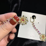 Silver Flower Earrings with Cubic Zirconia Pendant