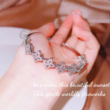 Silver Four Leaf Clover Cuff Bracelet with Zircon Dangle