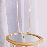 Baroque Pearl Necklace with Zircon and Emerald Inlay