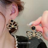 Electroplated Silver Needle Leather Wrapped Bow Earrings