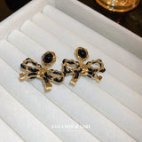 Electroplated Silver Needle Leather Wrapped Bow Earrings