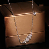 Zircon Inlaid Leaf Necklace with Feather Pendant