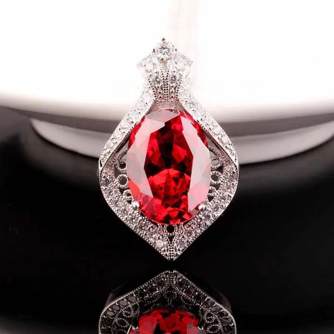 Large Oval Zircon Pendant with Inlaid Zircons