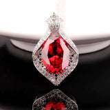 Large Oval Zircon Pendant with Inlaid Zircons