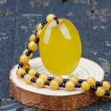 Hand-Carved Yellow Egg Noodle Pendant Charm Necklace