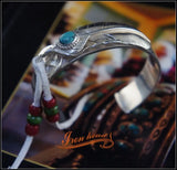 Iron Head Goros Silver Bangle with Turquoise Feather