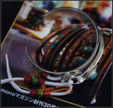 Iron Head Goros Silver Bangle with Turquoise Feather
