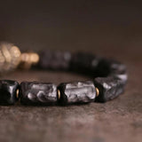 Ebony Beads Bracelet with Brass Charm
