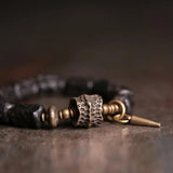 Ebony Beads Bracelet with Brass Charm