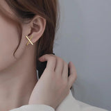 Korea's Cross-Cut Copper Zircon Earrings for Women