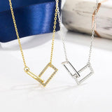 Double Ring Cross Necklace with Diamond Accent