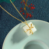 Silver Inlaid Hetian Jade Bow Pendant Necklace