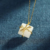 Silver Inlaid Hetian Jade Bow Pendant Necklace