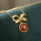 Ancient Craftsmanship Inlaid with Red Tourmaline Bow Pendant Necklace