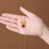 Ancient Craftsmanship Inlaid with Red Tourmaline Bow Pendant Necklace