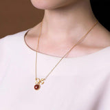 Ancient Craftsmanship Inlaid with Red Tourmaline Bow Pendant Necklace