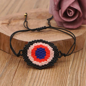 Hand-woven Rice Bead Bracelet with Devil's Eye Charm