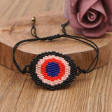 Hand-woven Rice Bead Bracelet with Devil's Eye Charm