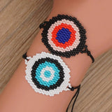 Hand-woven Rice Bead Bracelet with Devil's Eye Charm