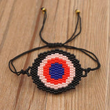Hand-woven Rice Bead Bracelet with Devil's Eye Charm