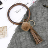 Woman PU Leather Metal Keychain Wrist Jewelry Hair Ball Tassel Bracelet Key Ring