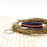 Spain Flag Keychain Elastic with Blue Background