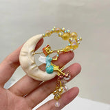 Muylinda Fairy Enamel Moon Girl Tassel Brooch