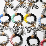 Silicone Cursive Cow Bead Bracelet Keychain Tassel Ox Head Wrist Key Ring Charm