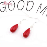 Coral Red Olivary Stone Earrings Tibetan Silver Hook Style