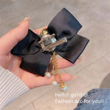 Vintage Flower Brooch with Pearl Tassel and Bowknot Design