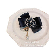 Vintage Flower Brooch with Pearl Tassel and Bowknot Design