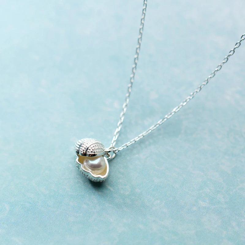 Sterling Silver Shell Necklace with Freshwater Pearl Pendant