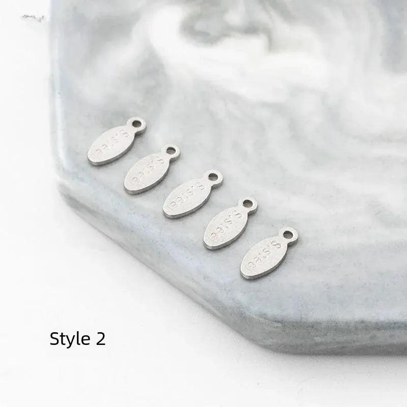 100pcs Stainless Steel Engraved Tail Chain Hook Spring Season Pendant