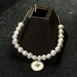 Freshwater Pearl Bracelet with Shell Disc Compass Charms