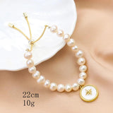 Freshwater Pearl Bracelet with Shell Disc Compass Charms