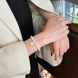 Freshwater Pearl Bracelet with Shell Disc Compass Charms