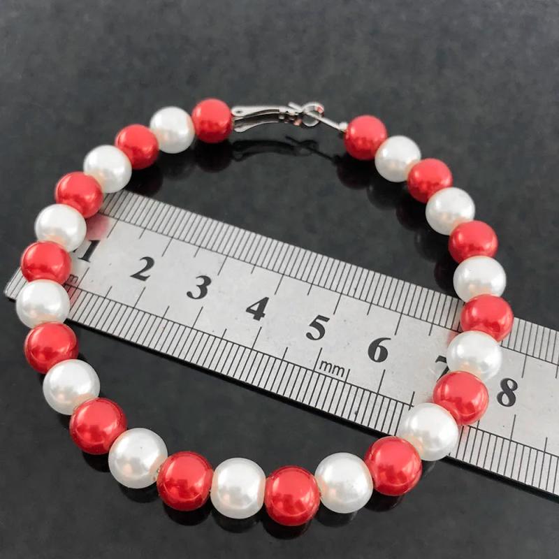 Red Pearl Earrings by Sisters Association - Elegant and Stylish