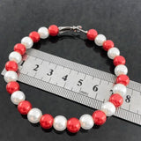 Red Pearl Earrings by Sisters Association - Elegant and Stylish
